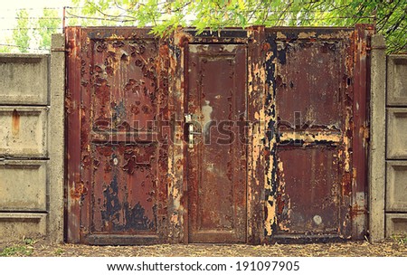Vintage style photo of a rusty gate