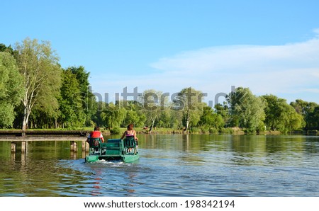 Water bikes on lake at a summer day