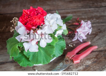 Bouquet of red and white geranium and oleander