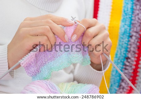 Woman knitting sweater