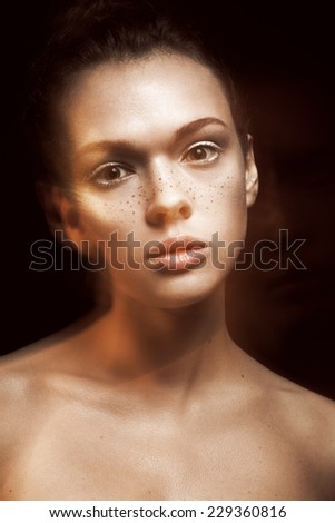 beauty portrait of beautiful young woman with clean face on dark background. Professional make up