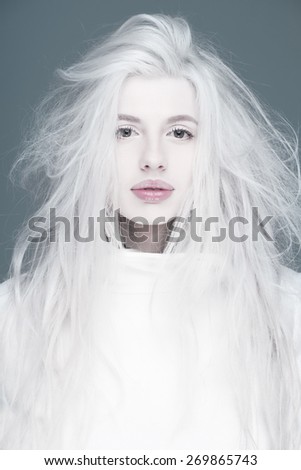 Blonde fashion woman in white coat pink  sexy lips portrait