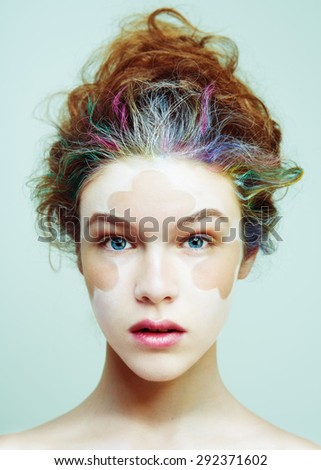 Color face art . Beauty portrait fashion model woman. Creative hair style and make-up