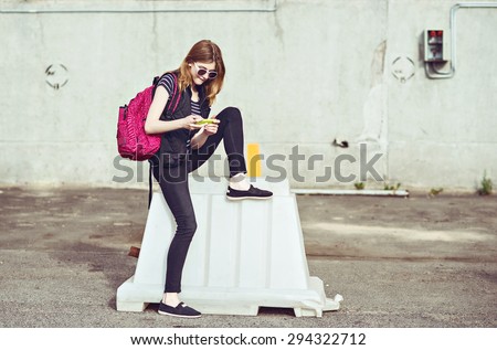 Happy woman using a smart phone in summer in a city.  close up of teenage girl hands with smartphone
