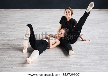 two dancers friends practice in dance studio