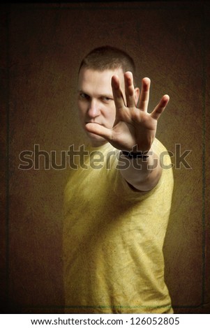 man holding out his hand to show stop