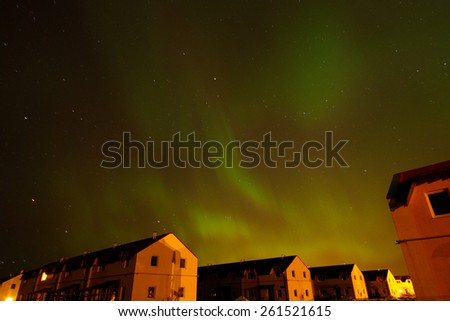Aurora borealis. Northern Lights over the farmhouses in Northern Europe. 2015, March 17-18