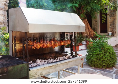 Outdoor grill with roasted meat in the village of Halki.  Naxos, Greece.