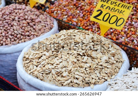 Pumpkin seeds and nuts in bags at spicy bazaar in Turkey