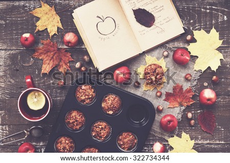 Cozy autumn breakfast - homemade apple muffins and cup of tea with lemon, top view