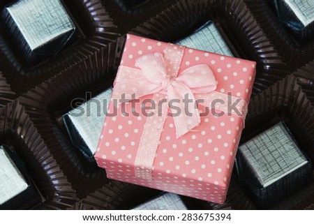 Gift Box and Box of Chocolate Candies. Close Up.