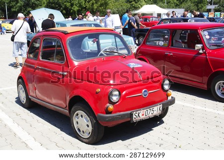 SKOPJE, MACEDONIA - JUNE 13, 2015: Unrecognizable people look around vintage cars on 10th Old Timer Car Show. The event organized by Euroimpex from Skopje.