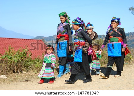 LAOCAI, VIETNAM, FEBRUARY 14: Hanhi ethnic minority women and their children go to spring festival on February 14, 2012 in Laocai, Vietnam. Hanhi is one of ethnic minority groups in Vietnam