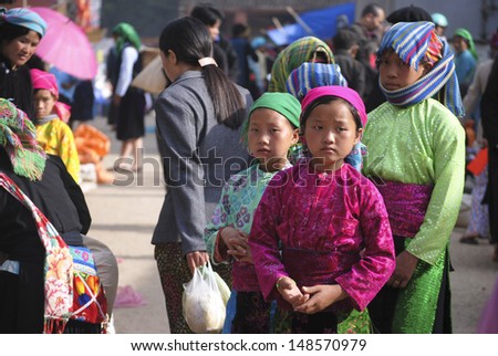 HAGIANG, VIETNAM, APRIL 30: Unidentified ethnic minority girls in a traditional market on April 30, 2011 in Hagiang, Vietnam. Hagiang is a northernmost province in Vietnam