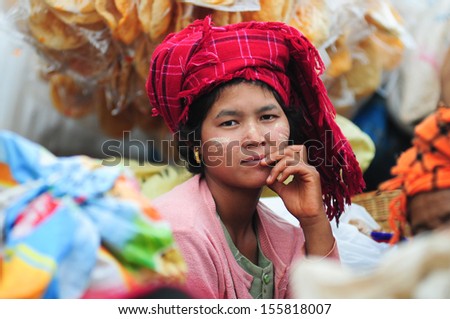 Inle Lake, Myanmar, September 5: An Unidentified Burmese Woman With Thanaka On Her Face On September 5, 2013 In Inle Lake, Myanmar. Thanaka Is A Yellowish-White Cosmetic Paste Made From Ground Bark.