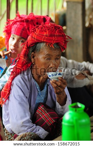 INLE LAKE, MYANMAR, SEPTEMBER 5: An unidentified Burmese ethnic minority woman in a traditional market on September 5, 2013 in Inle Lake, Myanmar. There are 8 ethnic minority group in Inle lake area
