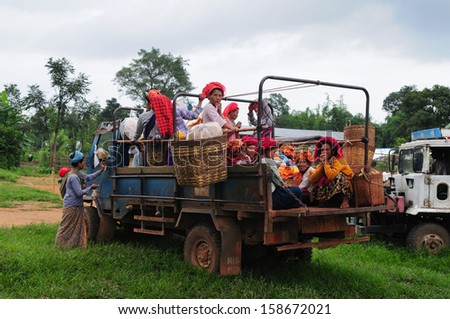INLE LAKE, MYANMAR, SEPTEMBER 5: unidentified Burmese women in a truck on September 5, 2013 in Inle Lake, Myanmar. Truck is a popular transportation in Myanmar because it can carry many people.