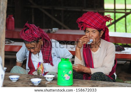INLE LAKE, MYANMAR, SEPTEMBER 5: Two unidentified Burmese ethnic minority women in a traditional market on September 5, 2013 in Inle Lake, Myanmar. There are 8 ethnic minority group in Inle lake area