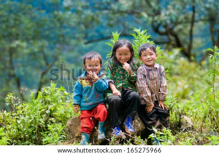 LAOCAI, VIETNAM, MAY 30: So, 4, Oc, 6, Ngao, 5, three ethnic children smile on MAY 30, 2013 in Laocai, Vietnam. There are many ethnic minority groups in Laocai