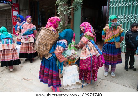 LAOCAI, VIETNAM, DECEMBER 28: H\'mong ethnic minority women in Bac Ha traditional market on December 28, 2013 in Laocai, Vietnam. H\'mong is the 8th largest ethnic group in Vietnam.