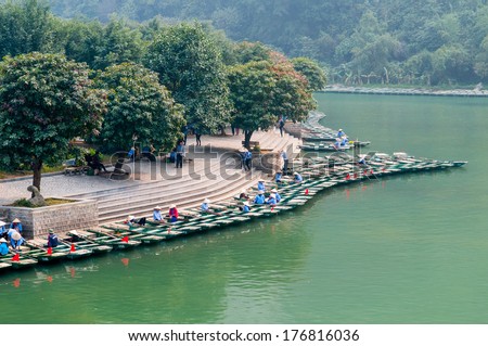 NINHBINH, VIETNAM, JANUARY 4: Unidentified boat owners wait for tourists visit Trang An grottoes on January 4, 2014 in Ninhbinh, Vietnam. Trang An grottoes are famous place in Ninhbinh province