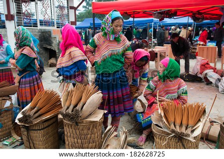 LAOCAI, VIETNAM, DECEMBER 28: H'mong ethnic minority women in Bac Ha traditional market on December 28, 2013 in Laocai, Vietnam. H'mong is the 8th largest ethnic group in Vietnam.