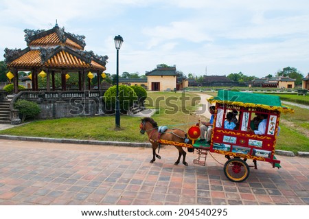 HUE, VIETNAM, MAY 4: A Vietnamese carriage run in Forbidden city on May, 4, 2014 in Hue, Vietnam. Carriage is a transportation for tourist in Hue Forbidden city