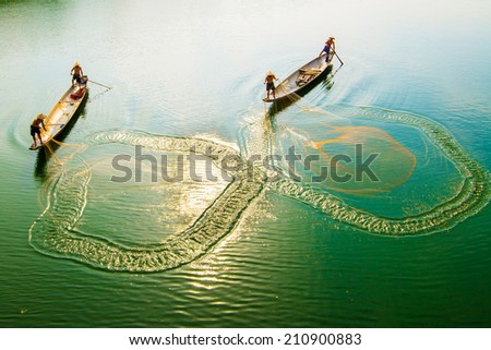 HUE, VIETNAM, MAY 2: An unidentified group of people are throwing fishing net on May 2, 2014 in Hue, Vietnam. Hue, a UNESCO World Heritage site.