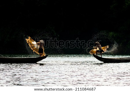 HUE, VIETNAM, MAY 2: Unidentified fishers are throwing fishing net on May 2, 2014 in Hue, Vietnam. Hue, a UNESCO World Heritage site.