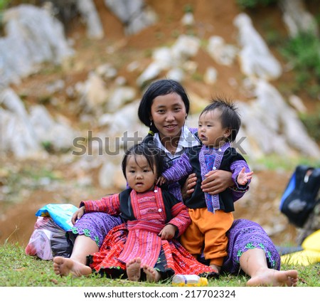 MOCCHAU, VIETNAM, SEPT 2: Unidentified H\'mong ethnic minority woman with her children in a festival on September 2, 2014 in Mocchau, Vietnam. This is biggest festival of H\'mong ethnic minority people.