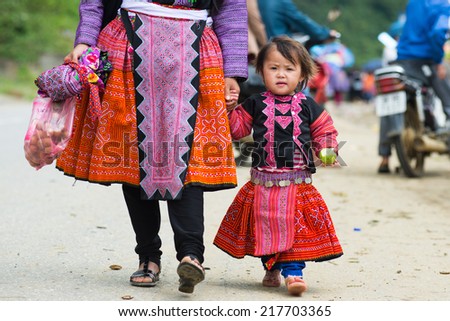 MOCCHAU, VIETNAM, SEPT 2: Sim, 4, H\'mong ethnic minority child in a festival on September 2, 2014 in Mocchau, Vietnam. This is biggest festival of H\'mong ethnic minority people.