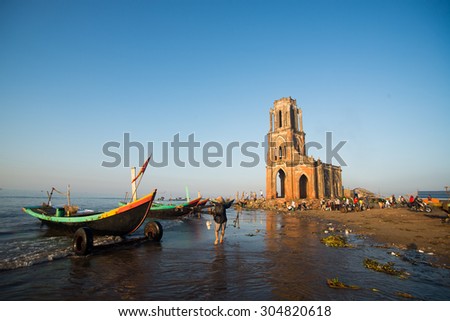 NAM DINH, VIETNAM - AUG 8, 2015: The fallen church (nha tho do) in sunrise in Hai Ly, Nam Dinh. The fallen church is the famous travel place in Nam Dinh.