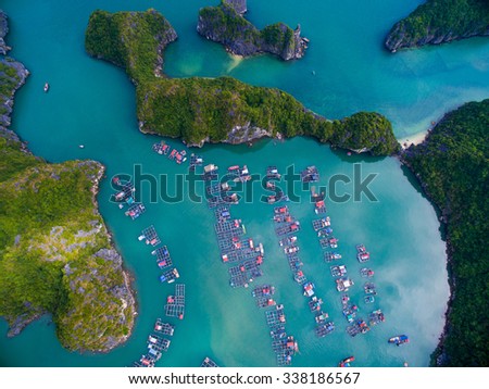 HAIPHONG, VIETNAM, November 8, 2015: Aerial view of floating villages around Cat Ba islands. Cat Ba is the largest of the 366 islands, which make up the southeastern edge of Ha Long Bay in Vietnam.