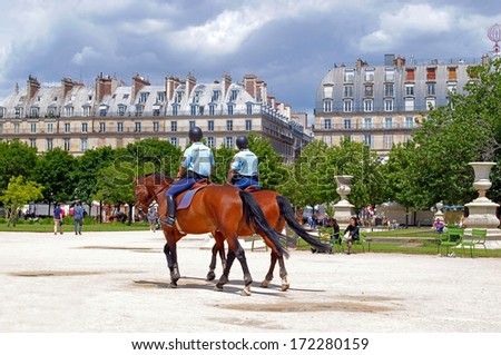 PARIS, FRANCE, June 22: Mounted police keeps order in the Tuileries Gardens June 22, 2012 in Paris. The Tuileries Garden is located between Place de la Concorde and the Louvre Museum.
