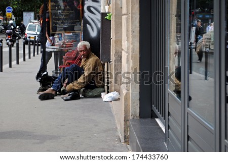 PARIS, FRANCE, June 21: Homeless man on the square Pegal, June 21, 2012 in Paris. Homeless. Series of other life in Paris.