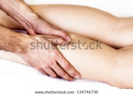 Physiotherapist massaging finger muscle to ease the pain