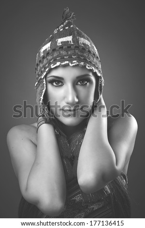 Smiley beauty, cap with tassels, jewelry, beautiful eyes and hands around her neck, black & white version.