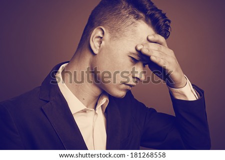 Portrait of a stressed businessman, with strong headache. Vintage version.