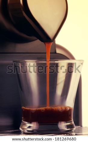 Close up coffee maker, brew a cup of espresso. White background. Vintage picture.