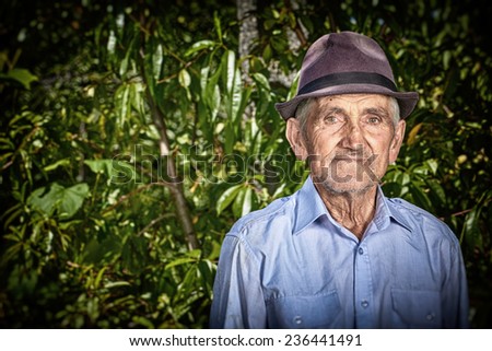 Portrait of an expressive old farmer outdoor.