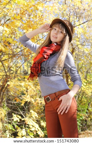 attractive young  girl posing in autumn park
