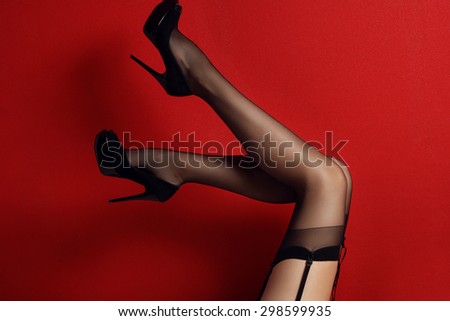 sexy female legs in black high heel shoes