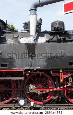 Steam locomotive takes water