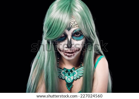 Beautiful woman with Sugar Skull Halloween makeup
