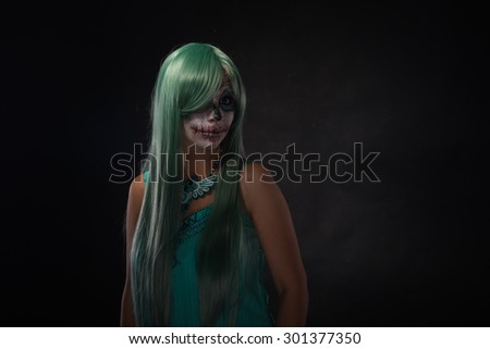 young woman with sugar skull makeup
