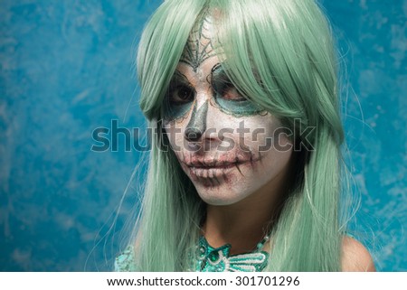young woman with sugar skull makeup