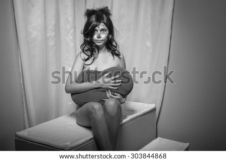 Black and white. Halloween portrait of young woman with sugar skull makeup