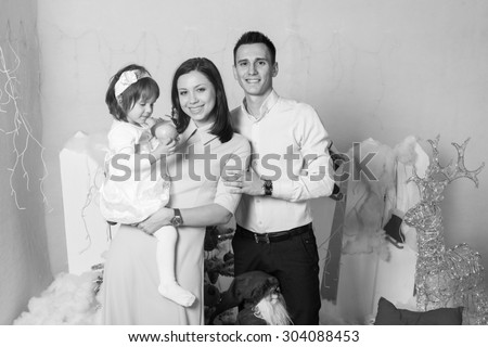 Black and White. BW. Family portrait with mother father and daughter