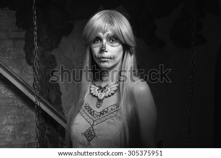 Black and white. Young woman with sugar skull makeup