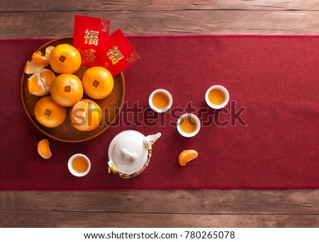 Translation of text appear in image: Prosperity and Spring. Flat lay Chinese new year food and drink still life. Text space image.